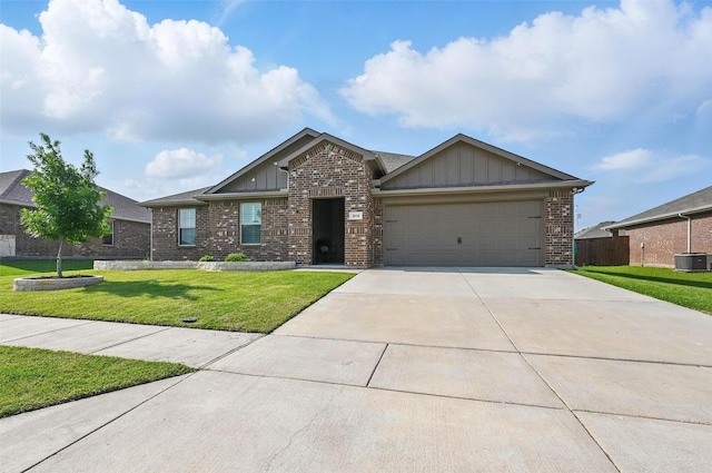 312 Duke Ct, Fate, TX 75189 - view of front of house featuring board and batten siding, brick siding, and an attached garage