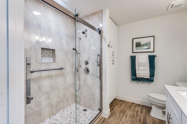 2120 Burnside Dr, Fort Worth, TX 76177 - bathroom with vanity, toilet, a stall shower, and wood finished floors