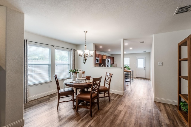 2120 Burnside Dr, Fort Worth, TX 76177 - dining space with wood finished floors, a chandelier, baseboards, and recessed lighting