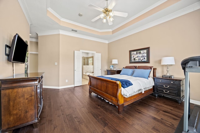508 Wellington Rd, Coppell, TX 75019 - bedroom featuring a raised ceiling, dark wood-style floors, crown molding, baseboards, and ensuite bath