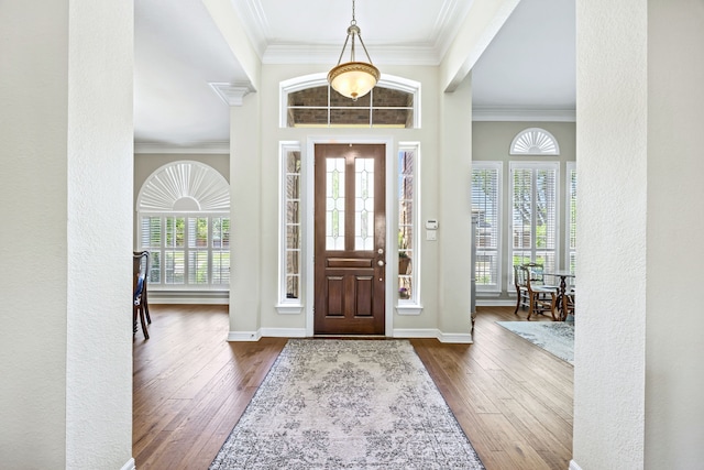 508 Wellington Rd, Coppell, TX 75019 - foyer entrance with ornamental molding, dark wood-style flooring, and baseboards