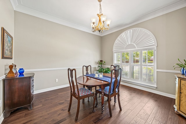 508 Wellington Rd, Coppell, TX 75019 - dining space with a chandelier, dark wood-style flooring, crown molding, and baseboards