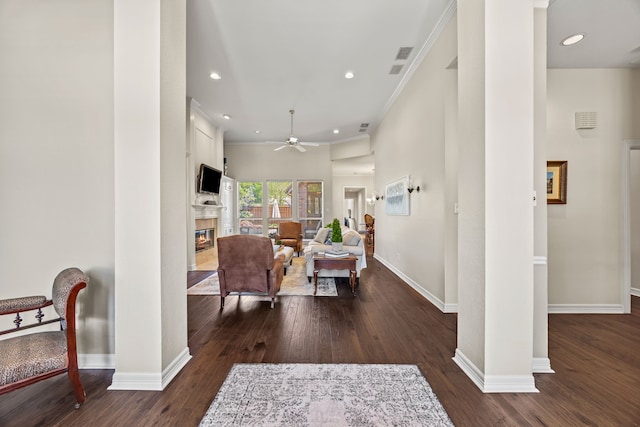 508 Wellington Rd, Coppell, TX 75019 - living room with a high end fireplace, ceiling fan, dark wood-type flooring, baseboards, and recessed lighting