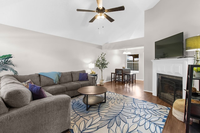 4411 Cordova Ln, Mckinney, TX 75070 - living room with a ceiling fan, wood finished floors, high vaulted ceiling, baseboards, and a fireplace