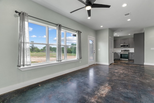 400 Round Up Ct, Stephenville, TX 76401 - unfurnished living room featuring baseboards, concrete flooring, ceiling fan, and recessed lighting