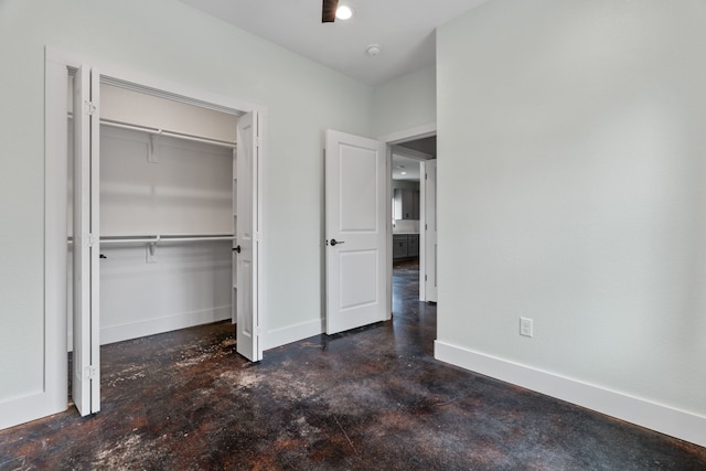 400 Round Up Ct, Stephenville, TX 76401 - unfurnished bedroom with concrete floors, a closet, and baseboards
