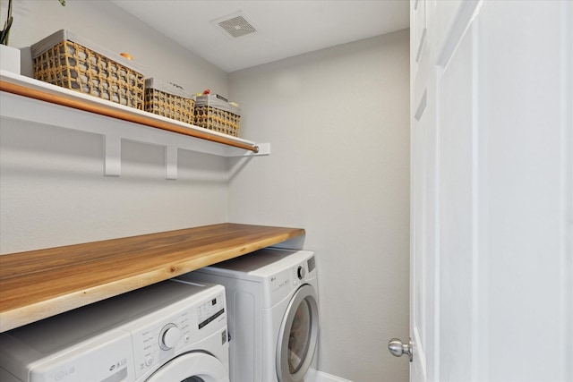 14065 Tanglebrush Trl, Fort Worth, TX 76052 - laundry room featuring washer and dryer and baseboards