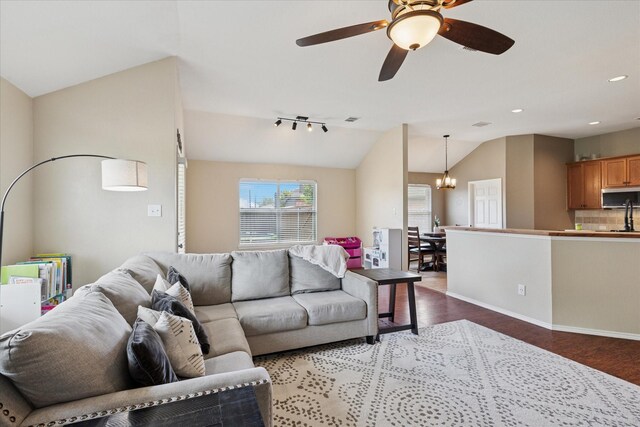 14065 Tanglebrush Trl, Fort Worth, TX 76052 - living area with lofted ceiling, wood finished floors, a chandelier, ceiling fan, and recessed lighting
