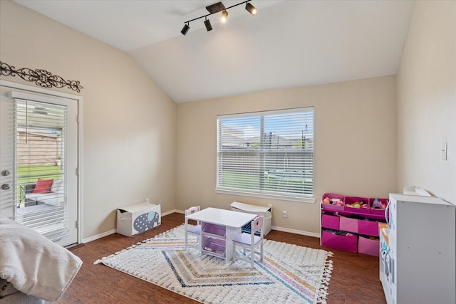 14065 Tanglebrush Trl, Fort Worth, TX 76052 - playroom with lofted ceiling, wood finished floors, baseboards, and rail lighting