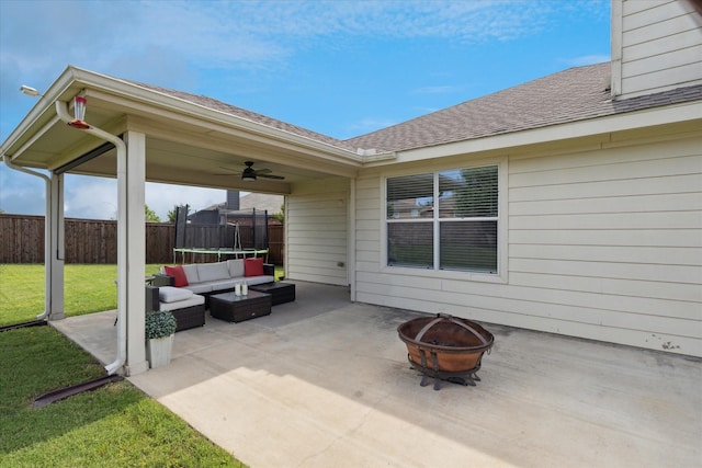 14065 Tanglebrush Trl, Fort Worth, TX 76052 - view of patio with a trampoline, an outdoor living space with a fire pit, and ceiling fan