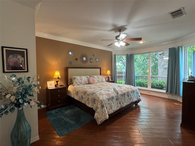 135 Freedom Ct, Rockwall, TX 75032 - bedroom with ornamental molding, dark wood-style flooring, a ceiling fan, and baseboards