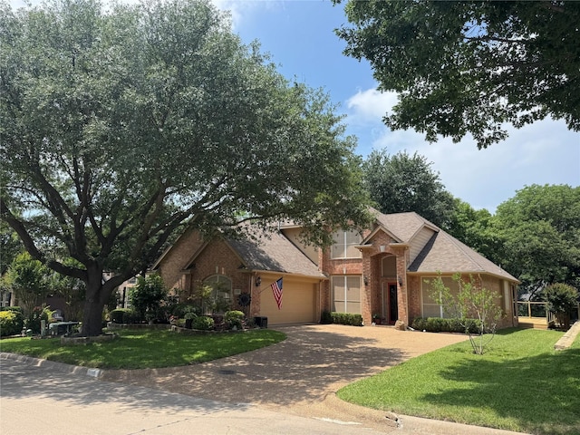 135 Freedom Ct, Rockwall, TX 75032 - view of front of house with brick siding, a garage, decorative driveway, and a front lawn