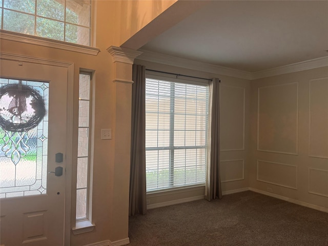 135 Freedom Ct, Rockwall, TX 75032 - foyer entrance featuring dark colored carpet and crown molding