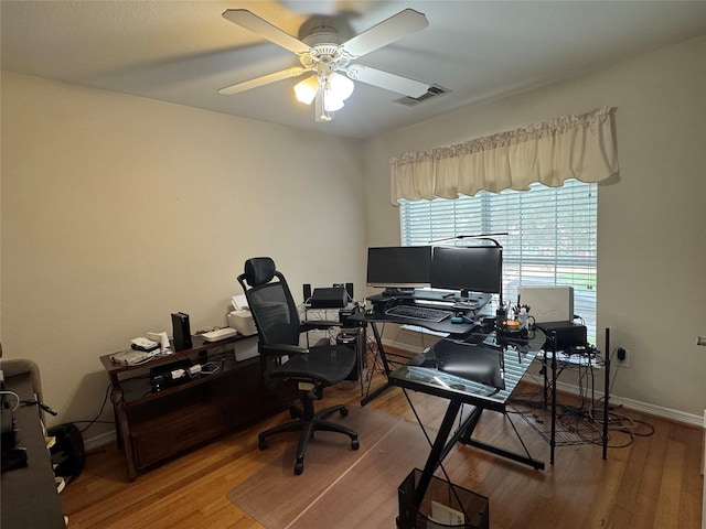 135 Freedom Ct, Rockwall, TX 75032 - home office with wood finished floors, a ceiling fan, and baseboards