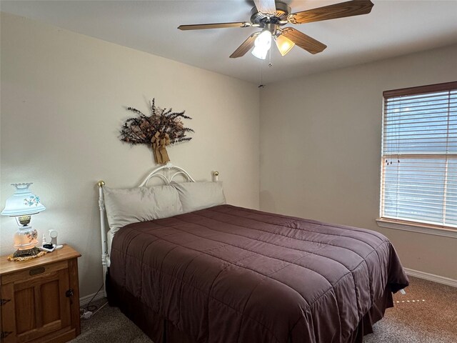 135 Freedom Ct, Rockwall, TX 75032 - bedroom with carpet, baseboards, and ceiling fan