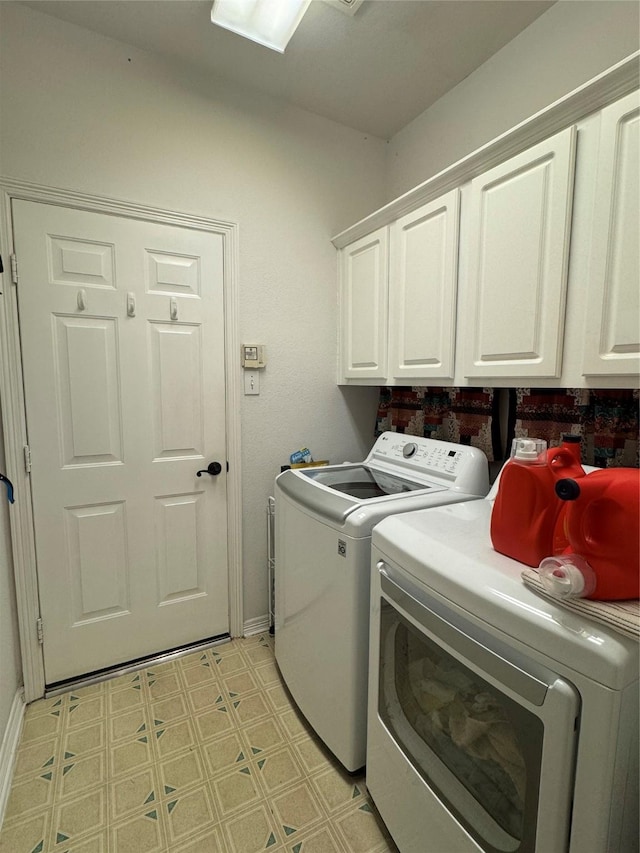 135 Freedom Ct, Rockwall, TX 75032 - washroom with cabinet space, washing machine and clothes dryer, light flooring, and baseboards