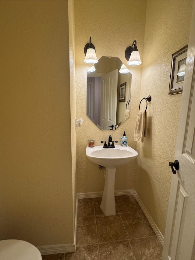 135 Freedom Ct, Rockwall, TX 75032 - half bathroom featuring baseboards, toilet, and tile patterned floors