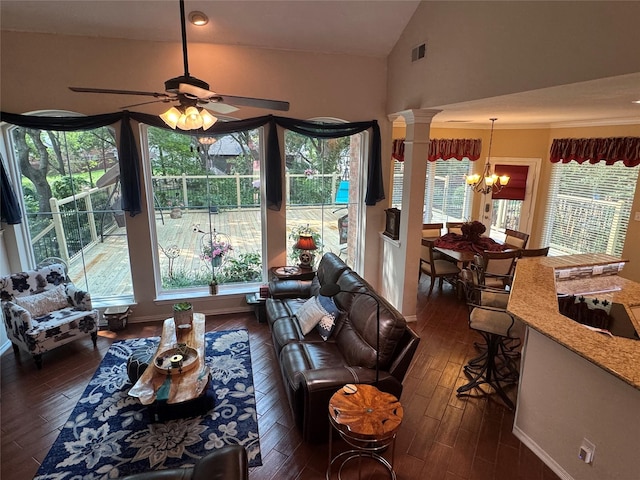 135 Freedom Ct, Rockwall, TX 75032 - living area with a chandelier, lofted ceiling, dark wood-type flooring, ornate columns, and a ceiling fan