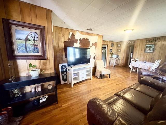 1103 Albert Broadfoot St, Bonham, TX 75418 - living area featuring wooden walls and wood finished floors