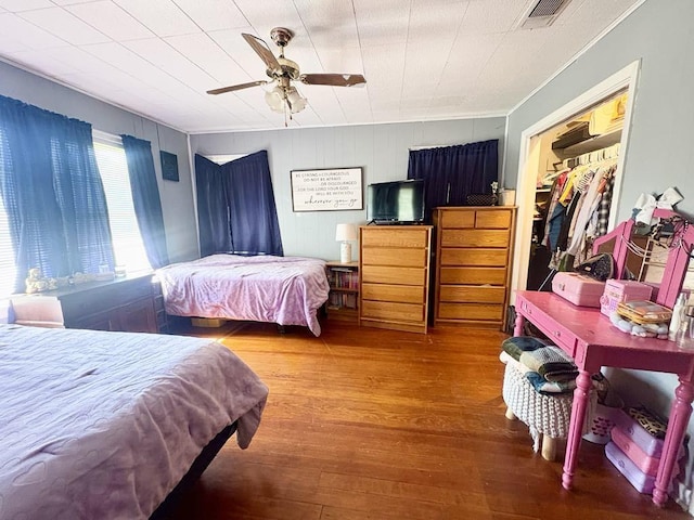 1103 Albert Broadfoot St, Bonham, TX 75418 - bedroom featuring wood-type flooring, ornamental molding, a ceiling fan, and a closet