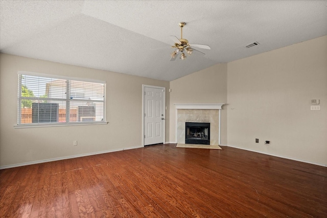 1214 Meadowbend Ct, Allen, TX 75002 - unfurnished living room featuring ceiling fan, wood finished floors, a textured ceiling, a fireplace, and vaulted ceiling