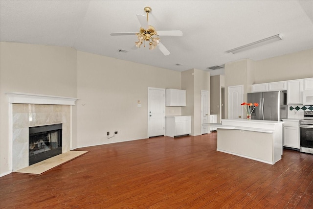 1214 Meadowbend Ct, Allen, TX 75002 - unfurnished living room featuring ceiling fan, dark wood-type flooring, and a tiled fireplace