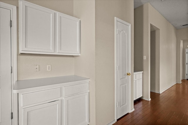 1214 Meadowbend Ct, Allen, TX 75002 - corridor with dark wood-type flooring and baseboards
