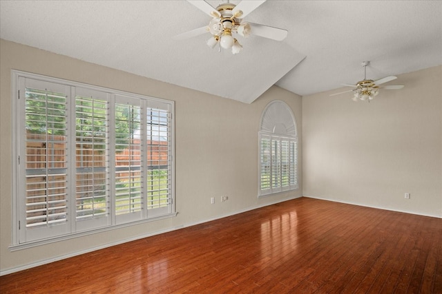 1214 Meadowbend Ct, Allen, TX 75002 - spare room featuring a ceiling fan, plenty of natural light, wood finished floors, vaulted ceiling, and baseboards