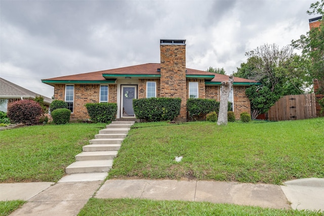 1740 Northview, Carrollton, TX 75007 - view of front of property with brick siding and a chimney
