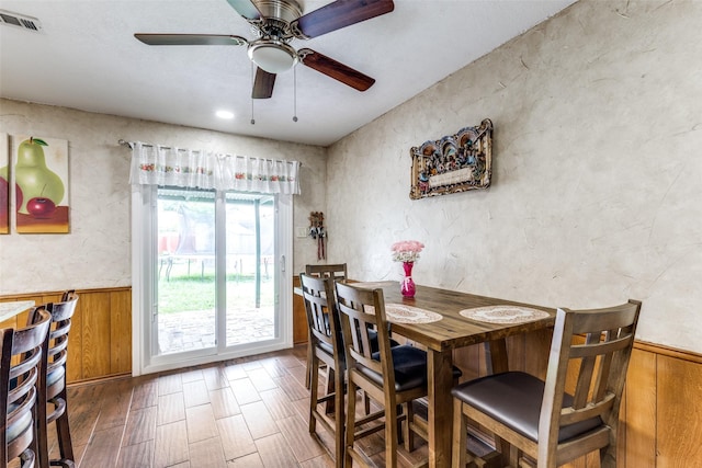 1740 Northview, Carrollton, TX 75007 - dining area with a wainscoted wall, wood finished floors, a ceiling fan, and wooden walls