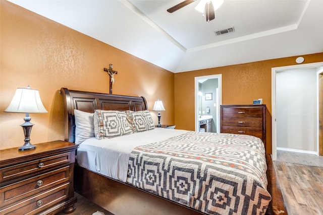1740 Northview, Carrollton, TX 75007 - bedroom with wood finished floors, a tray ceiling, connected bathroom, ceiling fan, and vaulted ceiling