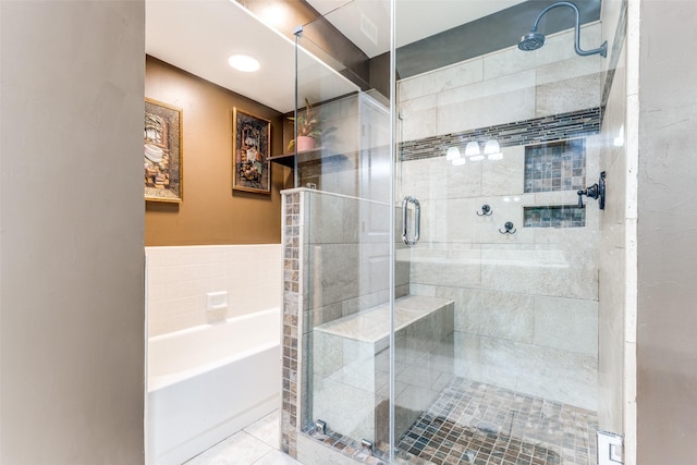1740 Northview, Carrollton, TX 75007 - bathroom featuring a shower stall, a garden tub, and tile walls