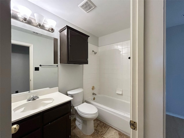 2114 Montclair Ln, Lewisville, TX 75067 - full bathroom featuring toilet, vanity, and bathtub / shower combination