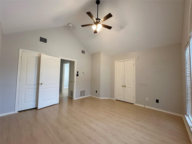 2114 Montclair Ln, Lewisville, TX 75067 - unfurnished bedroom with high vaulted ceiling, light wood-style floors, baseboards, and a ceiling fan