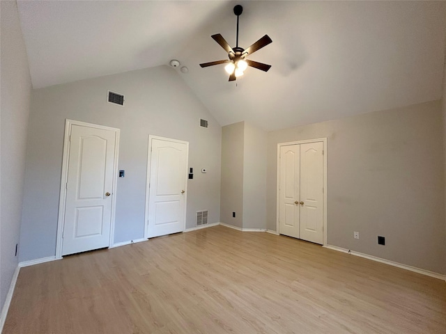 2114 Montclair Ln, Lewisville, TX 75067 - unfurnished bedroom with high vaulted ceiling, light wood-type flooring, baseboards, and a ceiling fan