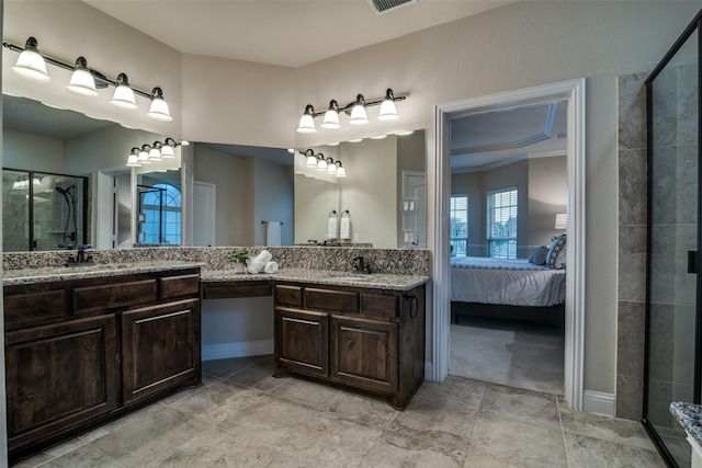 611 Southwestern Dr, Rockwall, TX 75087 - bathroom with a shower stall, connected bathroom, vanity, and baseboards