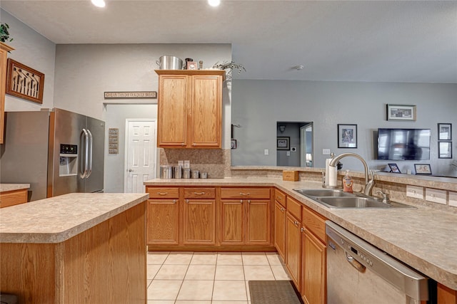 544 Bent Oak Dr, Fort Worth, TX 76131 - kitchen featuring stainless steel appliances, a sink, light countertops, light tile patterned floors, and decorative backsplash