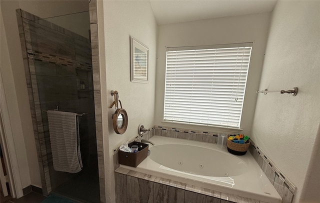 544 Bent Oak Dr, Fort Worth, TX 76131 - bathroom with a whirlpool tub, a tile shower, and a textured wall