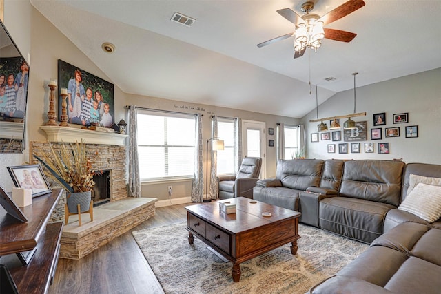 544 Bent Oak Dr, Fort Worth, TX 76131 - living area with vaulted ceiling, ceiling fan, wood finished floors, a stone fireplace, and baseboards
