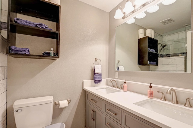 544 Bent Oak Dr, Fort Worth, TX 76131 - full bathroom featuring toilet, double vanity, a tile shower, and a textured wall