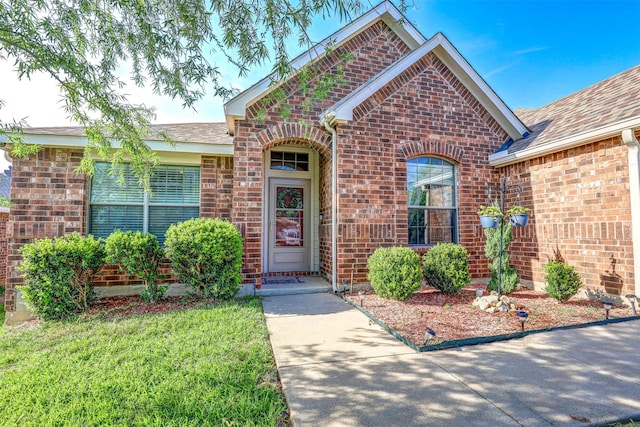 544 Bent Oak Dr, Fort Worth, TX 76131 - view of front of house featuring brick siding, a front lawn, and a shingled roof