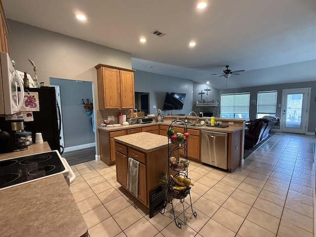 544 Bent Oak Dr, Fort Worth, TX 76131 - kitchen with stainless steel dishwasher, a ceiling fan, white microwave, a peninsula, and light tile patterned floors