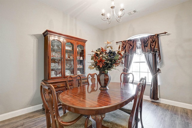 544 Bent Oak Dr, Fort Worth, TX 76131 - dining area featuring a chandelier, wood finished floors, and baseboards