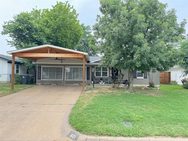 601 Alaska St, Arlington, TX 76011 - view of front facade with concrete driveway, brick siding, and ceiling fan