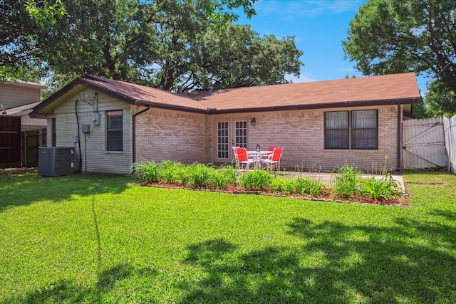 2827 Pritchett Dr, Irving, TX 75061 - back of house featuring brick siding, central air condition unit, a gate, and a patio