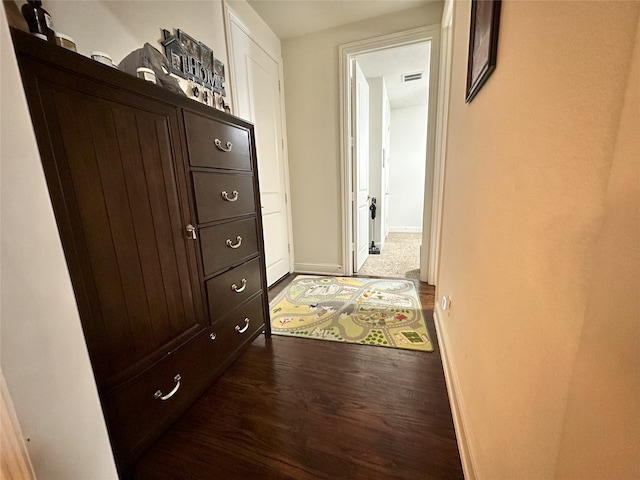 7239 Clementine Dr, Irving, TX 75063 - hallway featuring dark wood-style floors and baseboards