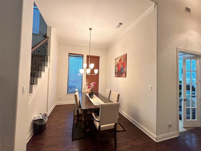 7239 Clementine Dr, Irving, TX 75063 - dining room with crown molding, dark wood-type flooring, baseboards, a chandelier, and stairs