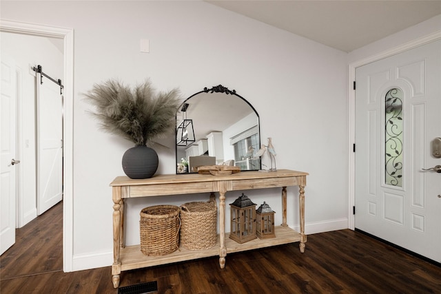 24882 US Highway 377, Whitesboro, TX 76273 - entrance foyer with a barn door, wood finished floors, and baseboards