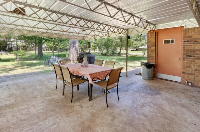 view of patio with outdoor dining space and grilling area