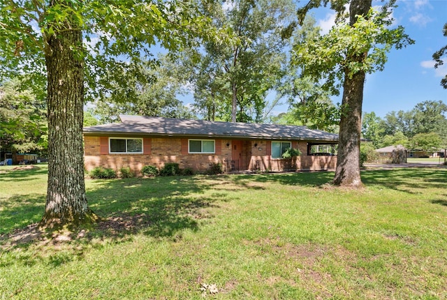 single story home featuring a front yard and brick siding